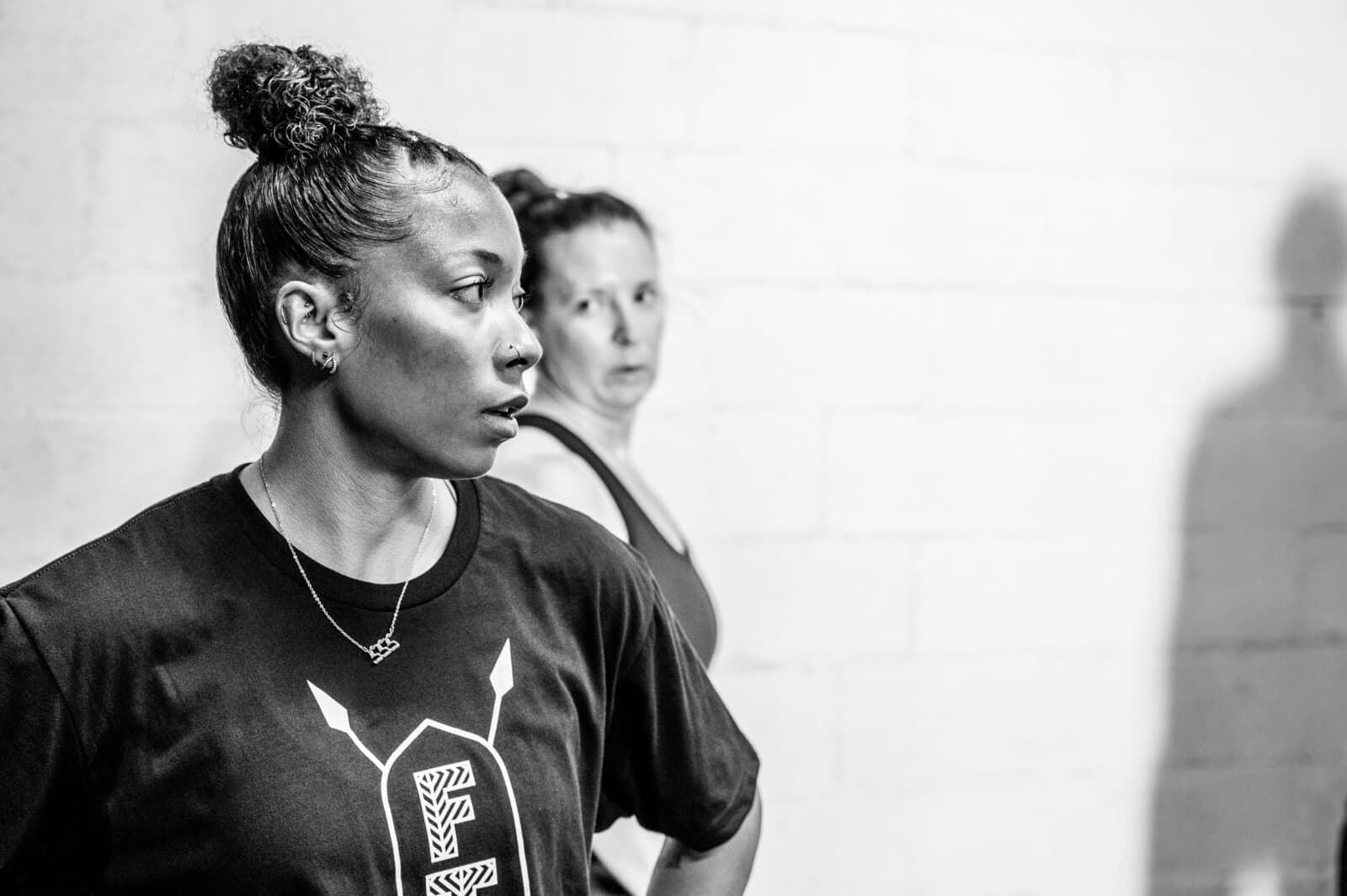 Fit Tribe coach helping a member train